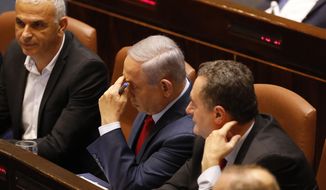 Israeli Prime Minister Benjamin Netanyahu before voting in the Knesset, Israel&#39;s parliament in Jerusalem, Wednesday, May 29, 2019. Israel&#39;s parliament has voted to dissolve itself, sending the country to an unprecedented second snap election this year as Prime Minister Benjamin Netanyahu failed to form a governing coalition before a midnight deadline. (AP Photo/Sebastian Scheiner)