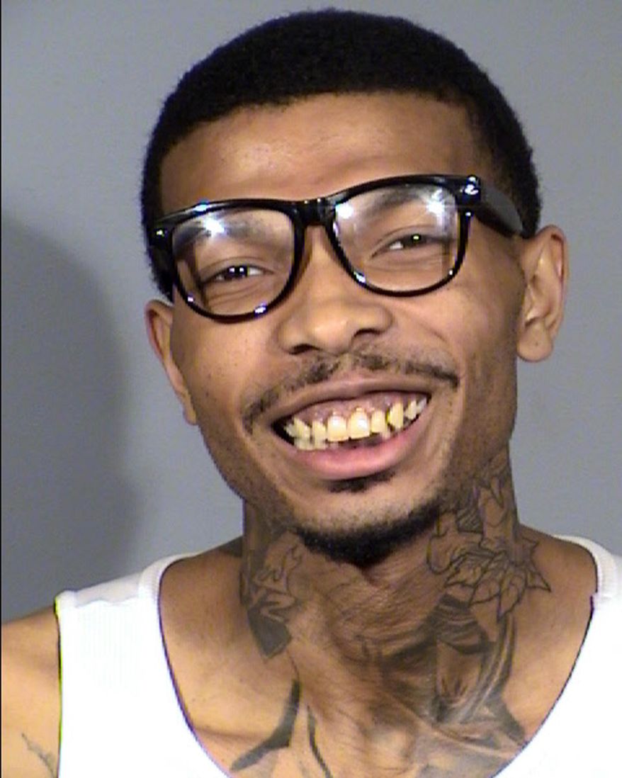 This undated Clark County Detention Center photo shows Hasean Quinn, 24, following his arrest Tuesday, May 28, 2019. Quinn is accused of firing a gunshot after a scuffle inside the Fashion Show on the Las Vegas Strip, sending panicked shoppers racing toward exits and drawing a heavy police response. Authorities say no one was injured in the Monday, May 17, 2019, shooting. (Las Vegas Metropolitan Police Department via AP)
