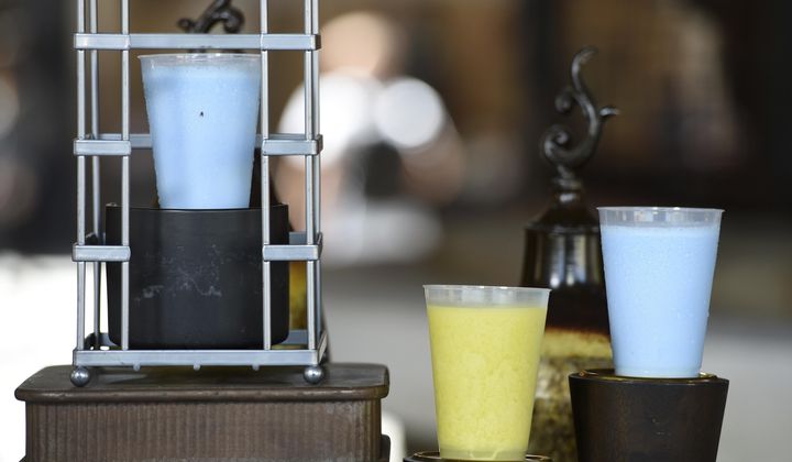 Blue Milk and Green Milk drinks, as seen in &quot;Star Wars&quot; films, are pictured in the Black Spire Outpost during the Star Wars: Galaxy&#x27;s Edge Media Preview at Disneyland Park, Wednesday, May 29, 2019, in Anaheim, Calif. (Photo by Chris Pizzello/Invision/AP)