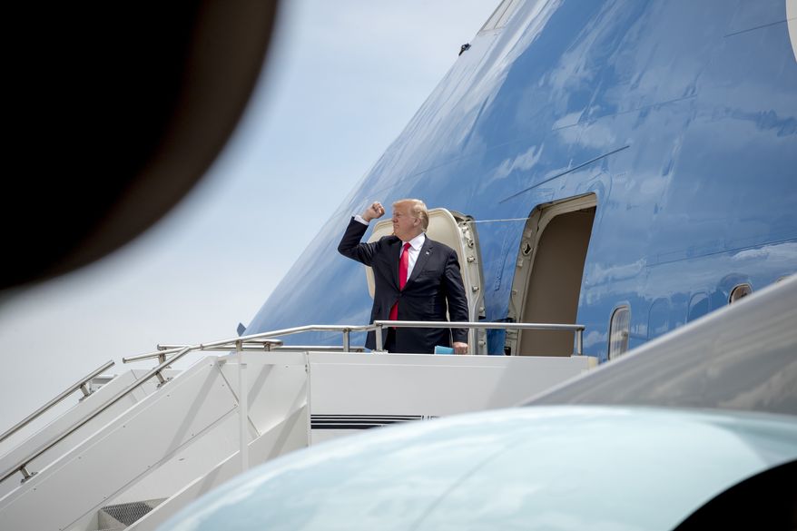 President Donald Trump boards Air Force One at Peterson Air Force Base, Colo., Thursday, May 30, 2019, to travel to Washington after attending the 2019 United States Air Force Academy Graduation Ceremony at the United States Air Force Academy. (AP Photo/Andrew Harnik)