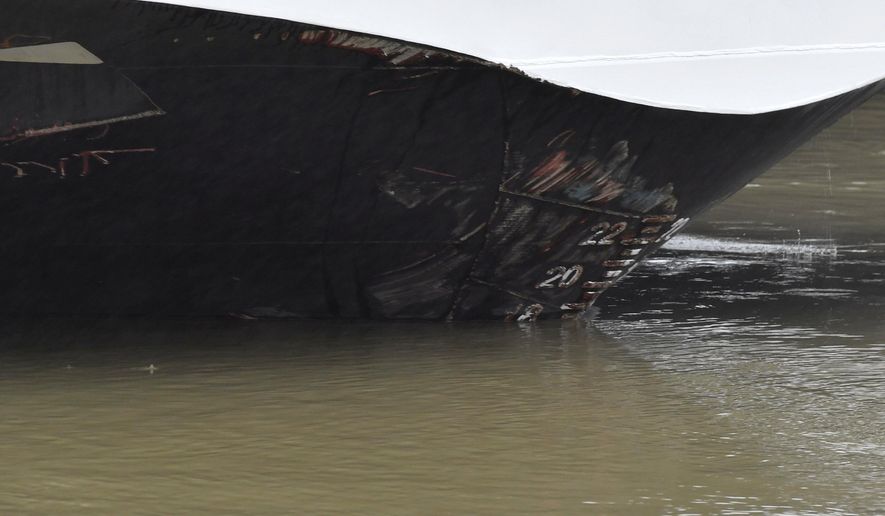 Abrasive damage is visible on the Viking Sigyn hotelship on the River Danube in downtown Budapest, Hungary, Thursday, May 30, 2019, following a collision of the hotelship and a sightseeing boat. A massive search was underway on the river for 21 people missing after the sightseeing boat with 33 South Korean tourists sank after colliding with another vessel during an evening downpour. (Zoltan Mathe/MTI via AP)