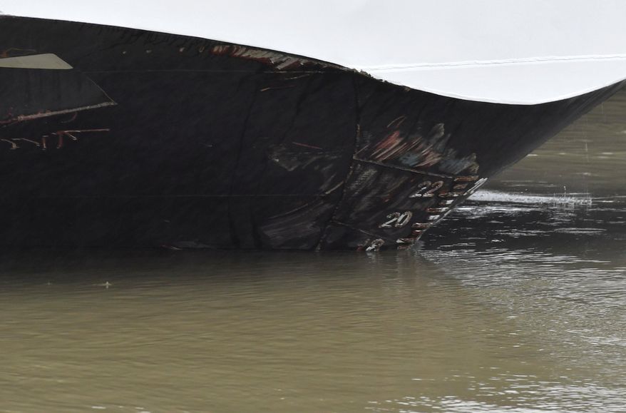 Abrasive damage is visible on the Viking Sigyn hotelship on the River Danube in downtown Budapest, Hungary, Thursday, May 30, 2019, following a collision of the hotelship and a sightseeing boat. A massive search was underway on the river for 21 people missing after the sightseeing boat with 33 South Korean tourists sank after colliding with another vessel during an evening downpour. (Zoltan Mathe/MTI via AP)