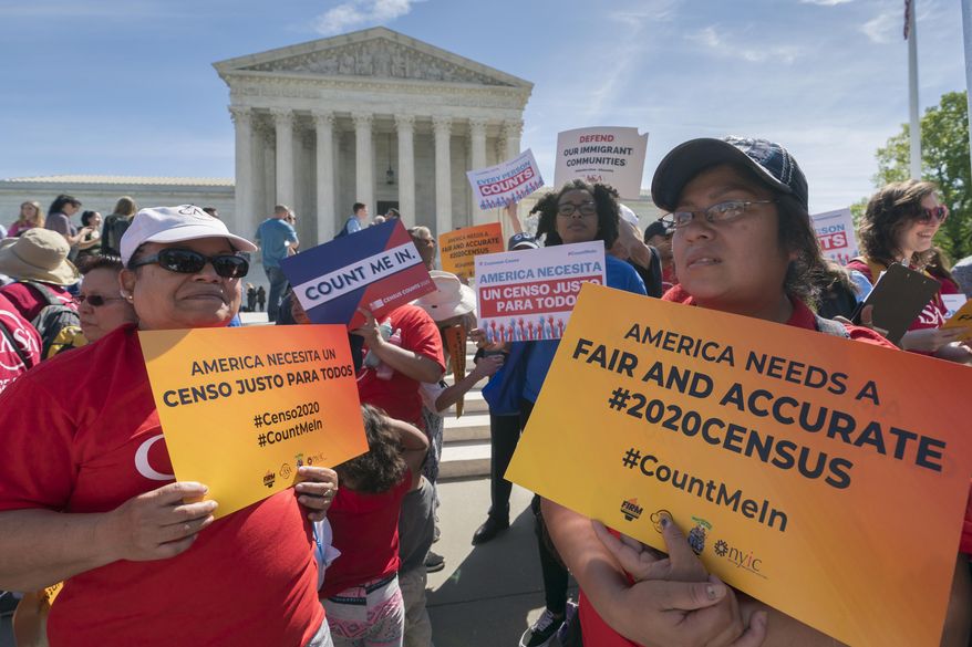 FILE - In this April 23, 2019 file photo, immigration activists rally outside the Supreme Court as the justices hear arguments over the Trump administration&#39;s plan to ask about citizenship on the 2020 census, in Washington. A new court filing Thursday, May 30 by lawyers opposing adding the citizenship question to the 2020 census alleges a longtime Republican redistricting expert played a key role in making the change. (AP Photo/J. Scott Applewhite, File)