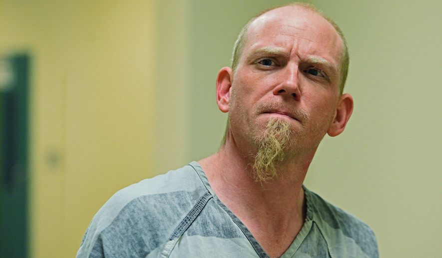 In this Dec. 8, 2016, photo, Keith Andrew Cornett is escorted into Minnehaha County Court in Sioux Falls, S.D. Cornett was sentenced Thursday, May 30, 2019, to life in prison for killing his 18-month-old stepson. (Joe Ahlquist/The Argus Leader via AP)