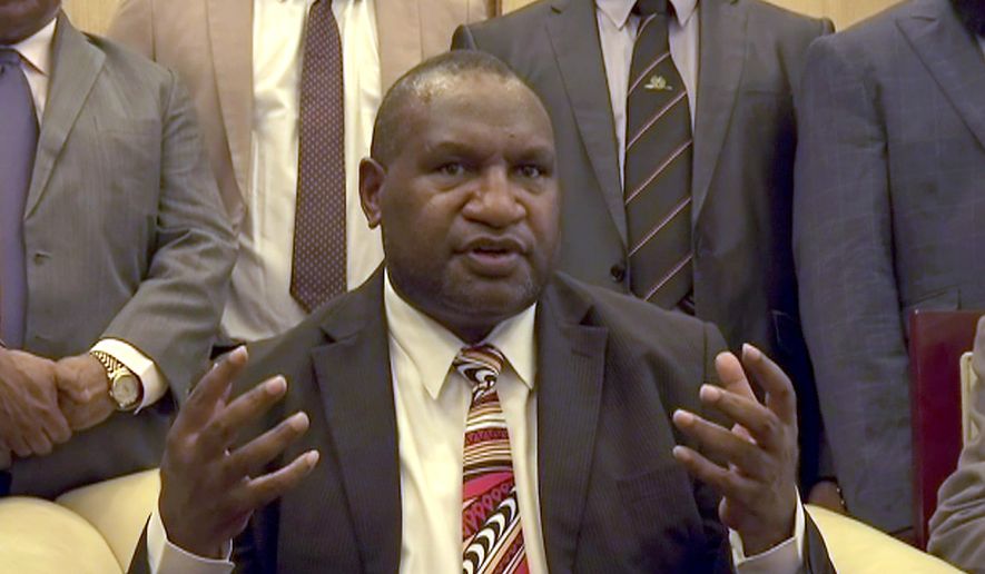In this image made from video, Papua New Guinea's new Prime Minister James Marape speaks to media after being sworn in, Thursday, May 30, 2019, in Port Moresby, Papua New Guinea. The former finance minister Marape has been sworn in as the country's new prime minister, following the resignation of Peter O'Neill last week. (Australian Broadcasting Corporation via AP)