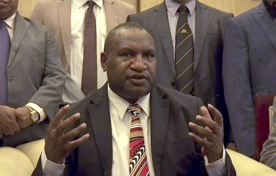 In this image made from video, Papua New Guinea's new Prime Minister James Marape speaks to media after being sworn in, Thursday, May 30, 2019, in Port Moresby, Papua New Guinea. The former finance minister Marape has been sworn in as the country's new prime minister, following the resignation of Peter O'Neill last week. (Australian Broadcasting Corporation via AP)