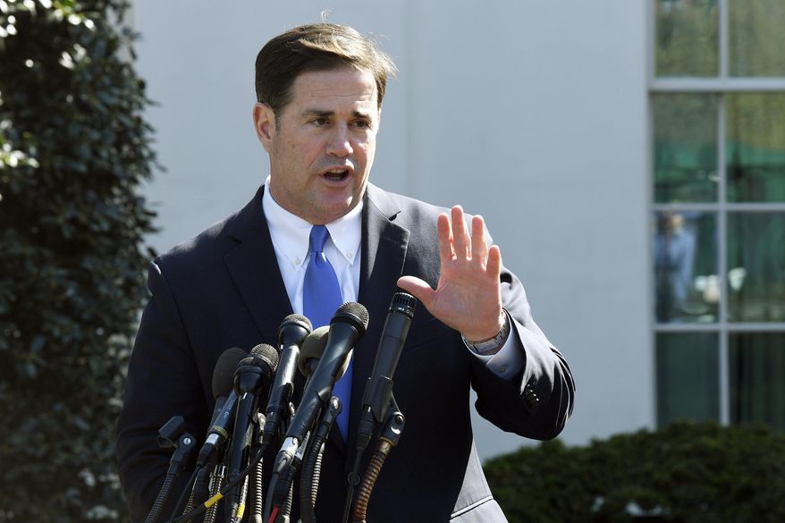 In this April 3, 2019, file photo, Arizona Gov. Doug Ducey talks to reporters outside the West Wing of the White House in Washington. (AP Photo/Susan Walsh, File)