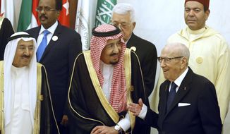 Kuwait&#39;s Emir Sheikh Sabah al-Ahmad al-Jaber al-Sabah, left, and Saudi Arabia&#39;s King Salman, center, listen to Tunisian President Beji Caid Essebsi, right, during a group photo session ahead of an emergency Arab summit in Mecca, Saudi Arabia, Thursday, May 30, 2019. King Salman opened an emergency summit of Gulf Arab leaders in the holy city of Mecca on Thursday with a call for the international community to use all means to confront Iran, but he also said the kingdom extends its hand for peace. (AP Photo/Amr Nabil)