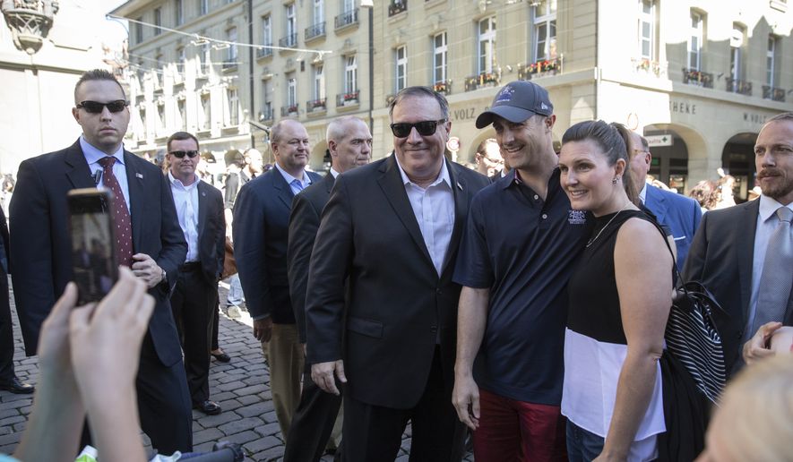 People take pictures of U.S. Secretary of State Mike Pompeo, center with sunglasses, during a sightseeing walk as part of Pompeo&#39;s visit in Bern, Switzerland, Saturday, June 1, 2019. (Peter Klaunzer/Keystone via AP)