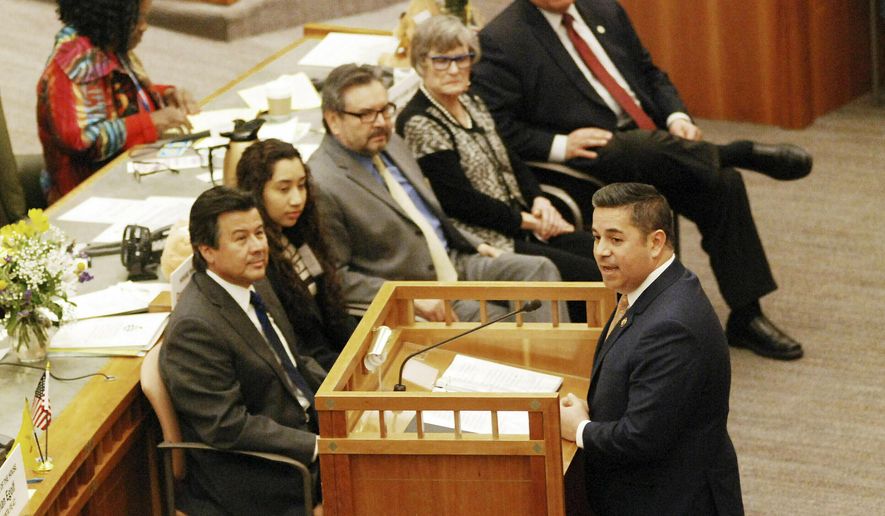 In this Thursday, Jan. 31, 2019, file photo, U.S. Rep. Ben Ray Lujan, of New Mexico, at the podium, addresses the state Legislature in Santa Fe, N.M. (AP Photo/Morgan Lee, File)