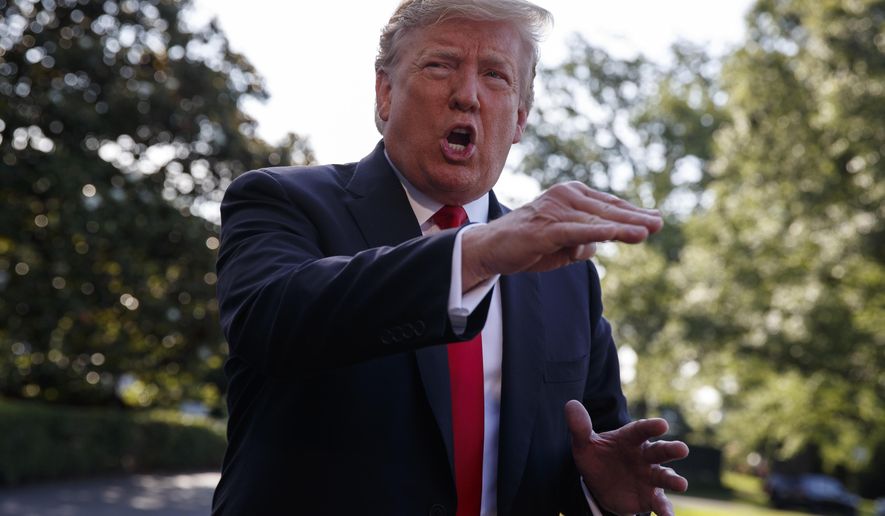 In this May 30, 2019, photo, President Donald Trump talks with reporters on the South Lawn of the White House in Washington. (AP Photo/Evan Vucci)