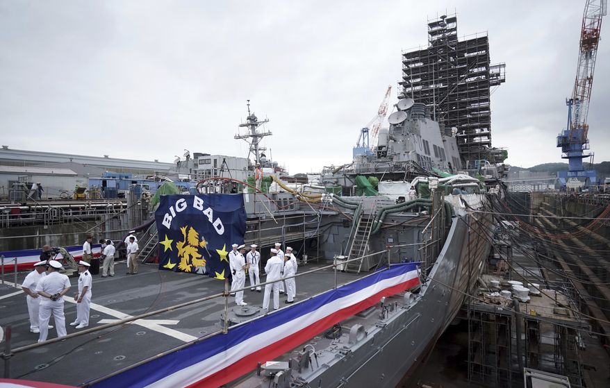 The USS John S. McCain under repair at a dry dock is seen after a rededication ceremony for at the U.S. Naval base in Yokosuka, southwest of Tokyo, Thursday, July 12, 2018. Navy Secretary Richard Spencer dedicated one of two destroyers involved in fatal accidents in the Pacific last year to Sen. John McCain. He added McCain&#39;s name to a Japan-based warship that was already named for the Arizona senator&#39;s father and grandfather. (AP Photo/Eugene Hoshiko)