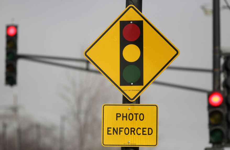 FILE -In 2017, AAA found that red-light cameras since 2013 were issuing $150 fines for cars that made rolling right-on-red turns, as well as for cars that ran through red lights. But the actual fine for a rolling right turn is $50, meaning the cameras were overcharging those violators $100 per ticket.
The Metropolitan Police Department has corrected the error and now reviews the tickets issued by the red-light cameras, which saved motorists $2.2 million in 2018. But many have yet to receive a refund for the erroneous fines from years past. (AP Photo/M. Spencer Green, File)