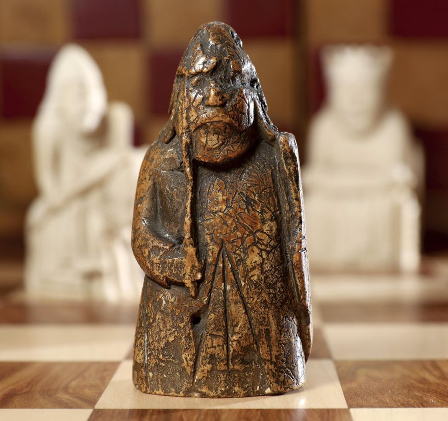 This image made available by Sotheby's on Monday June 3, 2019, shows a newly discovered Lewis Chessman on display at Sotheby's in London. The medieval chess piece purchased for five pounds by an antiques dealer in Scotland in 1964 has been found to be one of the famous medieval Lewis Chessmen and is expected to bring more than 600,000 pounds when auctioned by Sotheby’s on July 2. (Tristan Fewings/Sotheby's via AP)