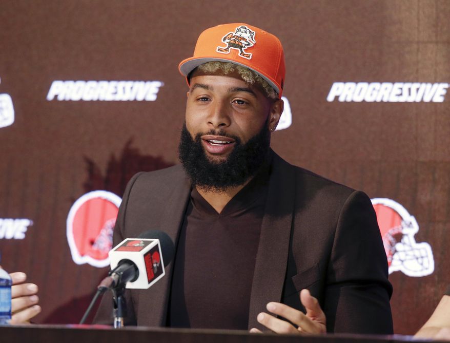 FILE- In this April 1, 2019, file photo, Cleveland Browns' Odell Beckham answers questions during a news conference in Berea, Ohio. Beckham reported for Cleveland’s mandatory minicamp and will practice Tuesday, June 4, 2019, after missing most of the team’s voluntary workouts. The star wide receiver has been away from the team and training in California. (AP Photo/Ron Schwane, File)