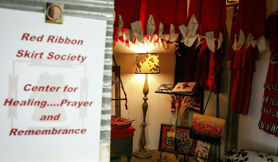 The entry to the Red Ribbon Skirt Societies Center for Healing Prayer and Remembrance for Missing and Murdered Indigenous Women at the Racing Magpie in Rapid City., S.D. The organization wants to raise awareness about the deaths and disappearances of indigenous women, children, two-spirited and transgender people. (Adam Fondren/Rapid City Journal via AP)