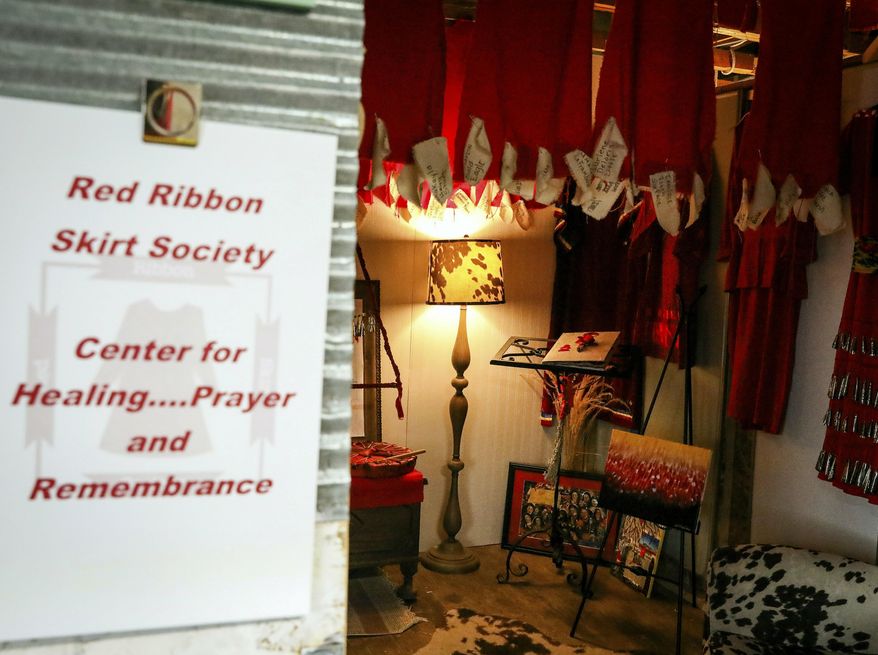 The entry to the Red Ribbon Skirt Societies Center for Healing Prayer and Remembrance for Missing and Murdered Indigenous Women at the Racing Magpie in Rapid City., S.D. The organization wants to raise awareness about the deaths and disappearances of indigenous women, children, two-spirited and transgender people. (Adam Fondren/Rapid City Journal via AP)