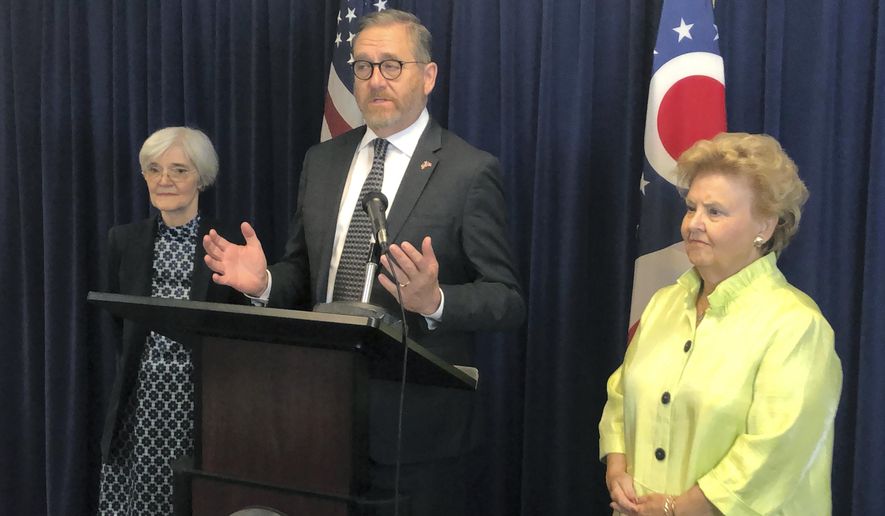 Ohio Attorney General David Yost, center, discusses his call to lawmakers to remove the statute of limitations for the crime of rape in Ohio, at a news conference attended by former attorneys general Nancy Rogers, left, and Betty Montgomery, right, on Monday, June 3, 2019, in Columbus, Ohio. (AP Photo/Andrew Welsh-Huggins)