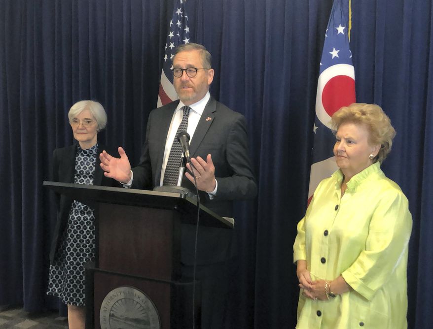 Ohio Attorney General David Yost, center, discusses his call to lawmakers to remove the statute of limitations for the crime of rape in Ohio, at a news conference attended by former attorneys general Nancy Rogers, left, and Betty Montgomery, right, on Monday, June 3, 2019, in Columbus, Ohio. (AP Photo/Andrew Welsh-Huggins)