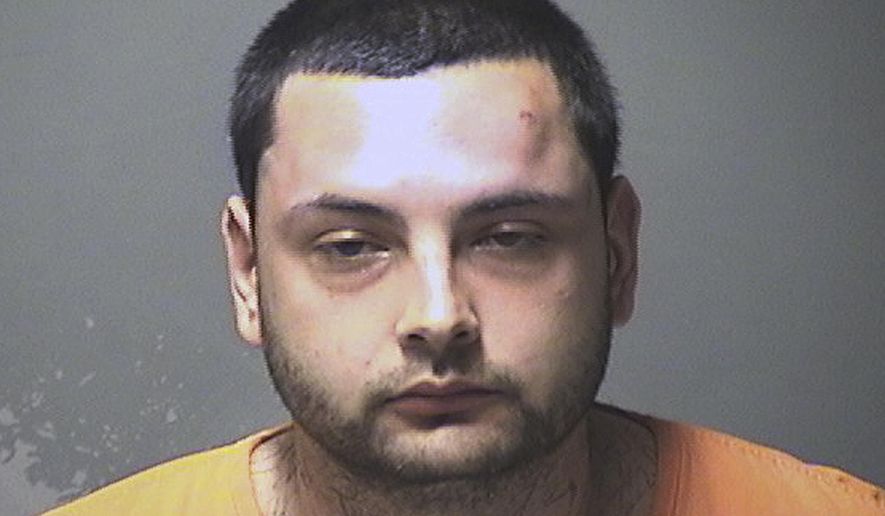 This booking photo released Monday, June 3, 2019, by the Manchester Police Department shows Carlos Alden, of Manchester, N.H., arrested and charged with stabbing a woman in the head, face and body multiple times on Sunday. (Manchester Police Department via AP)