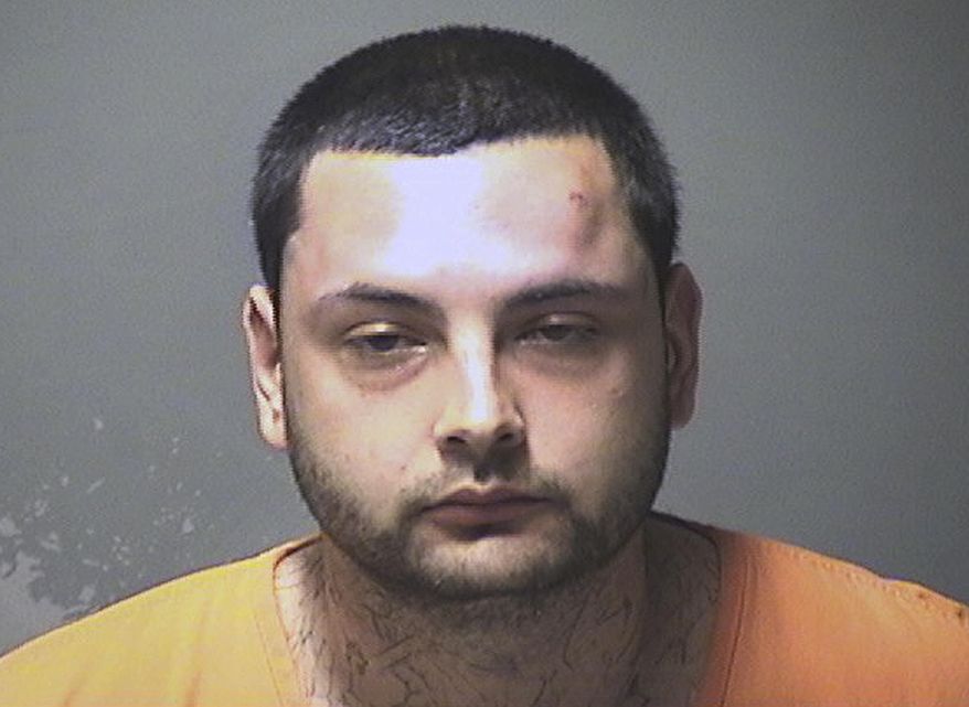 This booking photo released Monday, June 3, 2019, by the Manchester Police Department shows Carlos Alden, of Manchester, N.H., arrested and charged with stabbing a woman in the head, face and body multiple times on Sunday. (Manchester Police Department via AP)