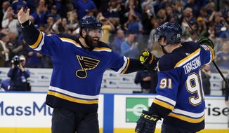 FILE - In this May 7, 2019, file photo, St. Louis Blues left wing Pat Maroon, left, and right wing Vladimir Tarasenko (91) celebrate the team&#39;s 2-1 win against the Dallas Stars in two overtimes in Game 7 of an NHL second-round hockey playoff series in St. Louis. Maroon had other offers for more money and more years but chose to sign with his hometown St. Louis Blues. (AP Photo/Jeff Roberson, File)