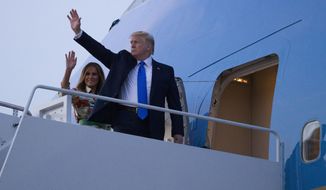 President Donald Trump, with first lady Melania Trump, wave as they board Air Force One as they depart Sunday, June 2, 2019, at Andrews Air Force Base, Md. Trump is going to London, France and Ireland. (AP Photo/Alex Brandon)