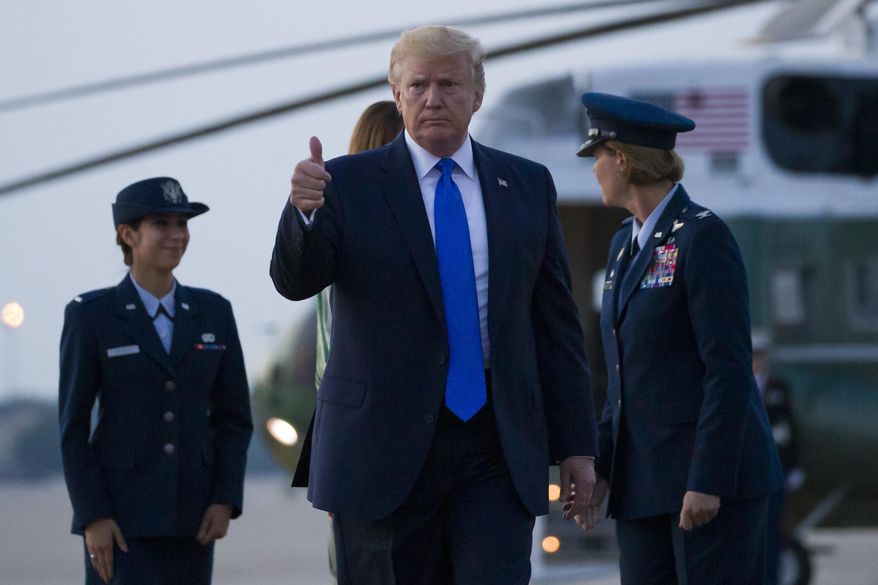 President Donald Trump, with first lady Melania Trump, gives a thumbs up as the walk to Air Force One, as they depart Sunday, June 2, 2019, at Andrews Air Force Base, Md. Trump is going to London, France and Ireland. (AP Photo/Alex Brandon)