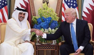 US President Donald Trump (R) and Qatar&#39;s Emir Sheikh Tamim Bin Hamad Al-Thani take part in a bilateral meeting at a hotel in Riyadh on May 21, 2017. (Photo Credit: MANDEL NGAN/AFP/Getty Images)