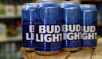 In a Thursday Jan. 10, 2019, photo, cans of Bud Light beer are seen in Washington. (AP Photo/Jacquelyn Martin) **FILE**