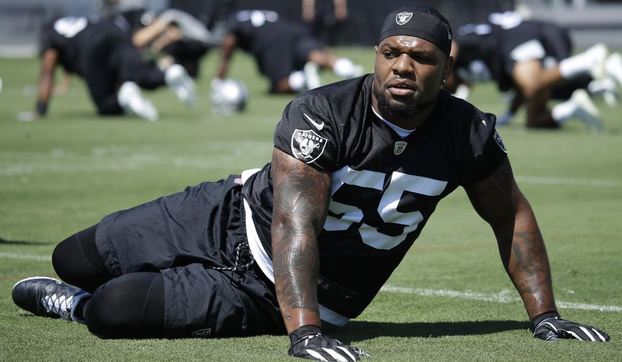 Oakland Raiders' Vontaze Burfict stretches during NFL football practice on Tuesday, June 4, 2019, at the team's training facility in Alameda, Calif. (AP Photo/Ben Margot)