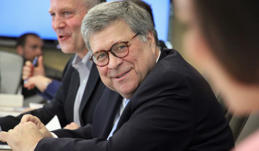 U.S. Attorney General William Barr, middle, smiles during a light moment when listening to concerns raised about public safety in rural Alaska during at a roundtable discussion at the Alaska Native Tribal Health Consortium on Wednesday, May 29, 2019, in Anchorage, Alaska. (AP Photo/Mark Thiessen)