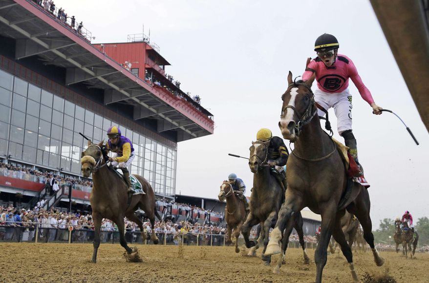 In this May 18, 2019, file photo, Jockey Tyler Gaffalione, right, reacts aboard War of Will, as they cross the finish line first to win the Preakness Stakes horse race at Pimlico Race Course, in Baltimore. Gaffalione at 24 has become horse racing’s rising star jockey after winning the Preakness and can add to his already impressive resume in the Belmont. (AP Photo/Steve Helber, File) **FILE**