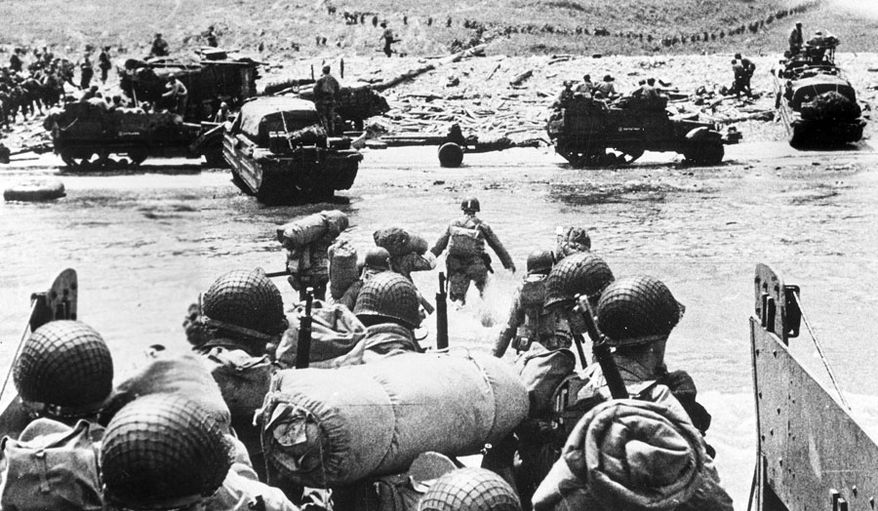 American soldiers and supplies arrive on the shore of the French coast of German-occupied Normandy during the Allied D-Day invasion on June 6, 1944 in World War II. (AP Photo)