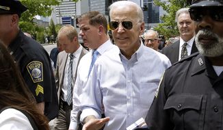 Former Vice President and Democratic presidential candidate Joe Biden walks with Boston Mayor Marty Walsh, left, on Wednesday, June 5, 2019, in downtown Boston. (AP Photo/Steven Senne)
