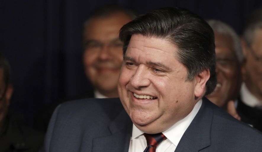 Gov. J.B. Pritzker smiles during a bill signing Wednesday, June 5, 2019, at the Thompson Center in downtown Chicago. (AP Photo/Charles Rex Arbogast) ** FILE **