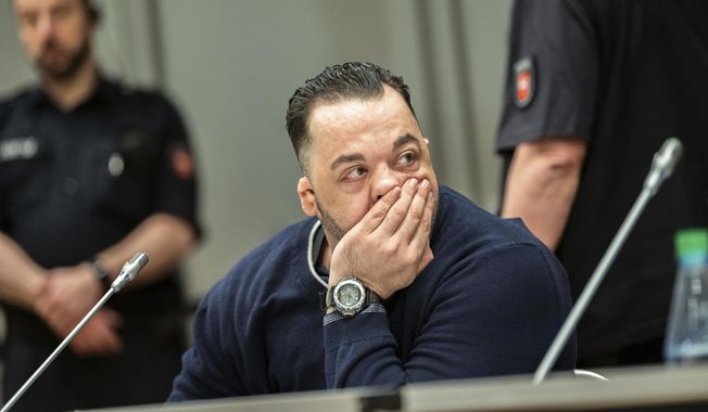 Former nurse Niels Hoegel, left, accused of multiple murder and attempted murder of patients, attends a session of the district court in Oldenburg, Germany, Wednesday, June 5, 2019. (Mohssen Assanimoghaddam/dpa via AP, Pool)