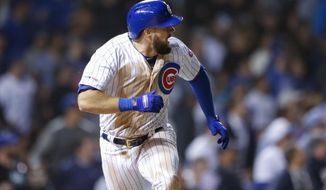 Chicago Cubs&#39; David Bote watches his three-run double against the Colorado Rockies during the sixth inning of a baseball game Wednesday, June 5, 2019, in Chicago. (AP Photo/Kamil Krzaczynski)