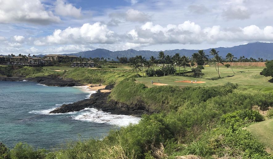 In this Nov. 15, 2018 photo, the 14th hole at the Hokuala Ocean Course in Lihue, Hawaii cuts across the Pacific Ocean on the east side of Kauai. On Tuesday, June 18, 2019, protesters formed a human chain and blocked tourists from using a Kauai highway to access an area they said cannot support a large influx of people, according to reports. (AP Photo/John Marshall) **FILE**