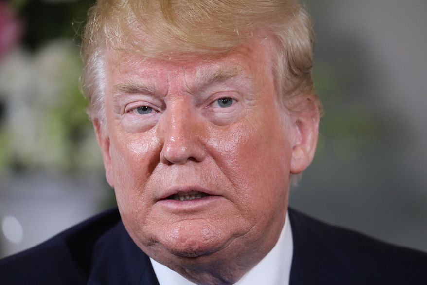 U.S President Donald Trump looks on during a meeting with French President Emmanuel Macron at the Prefecture of Caen, Normandy, France, Thursday, June 6, 2019. World leaders are gathered Thursday in France to mark the 75th anniversary of the D-Day landings. (Ludovic Marin/POOL via AP)