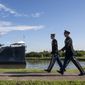 Army Staff Sgt. Jacob Klein, left, and Staff Sgt. Joel Ocasio arrive to the Battleship Texas to participate in a ceremony commemorating the 75th anniversary of D-Day on Thursday, June 6, 2019, in La Porte, Texas. The U.S.S. Texas was part of the D-Day operations in Normandy and is the last remaining battleship to have served during the invasion. (Brett Coomer/Houston Chronicle via AP)