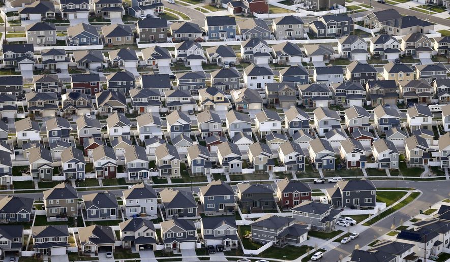 FILE - This April 13, 2019, file photo, shows rows of homes, in suburban Salt Lake City. On Thursday, June 6, Freddie Mac reports on this week’s average U.S. mortgage rates. (AP Photo/Rick Bowmer, File)