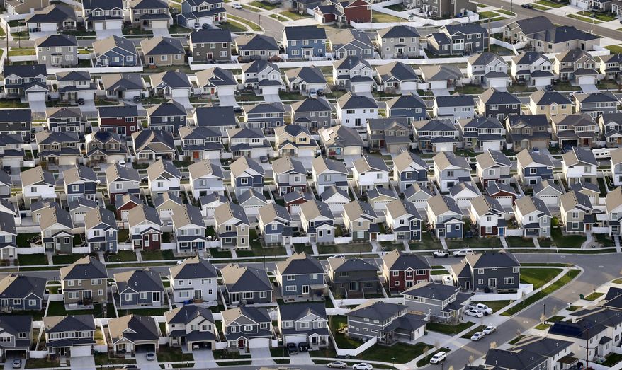 FILE - This April 13, 2019, file photo, shows rows of homes, in suburban Salt Lake City. On Thursday, June 6, Freddie Mac reports on this week’s average U.S. mortgage rates. (AP Photo/Rick Bowmer, File)