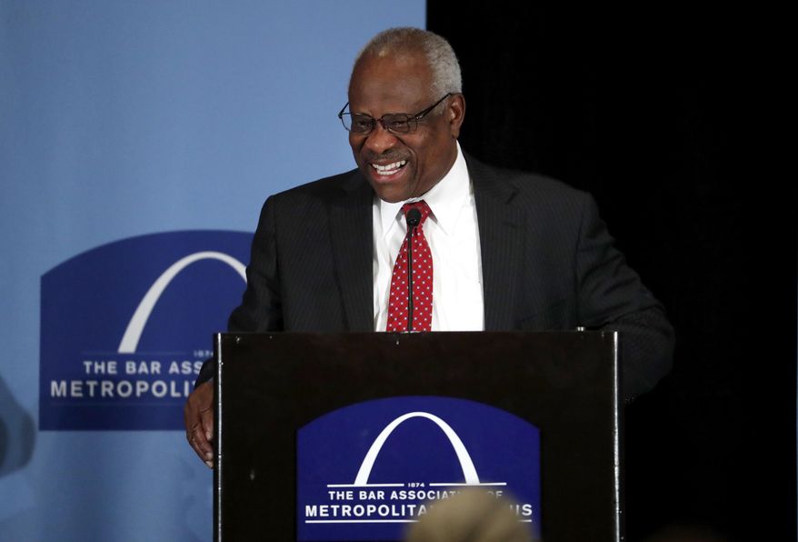 FILE - In this May 5, 2017, file photo, Supreme Court Justice Clarence Thomas speaks at the Bar Association of Metropolitan St. Louis in St. Louis. Thomas and his wife, Ginni, take to the road in a 40-foot RV most summers. They hit 23 states last summer, he said Monday, June 3, 2019, in a talk in the courtroom sponsored by the Supreme Court Historical Society. (AP Photo/Jeff Roberson, File)