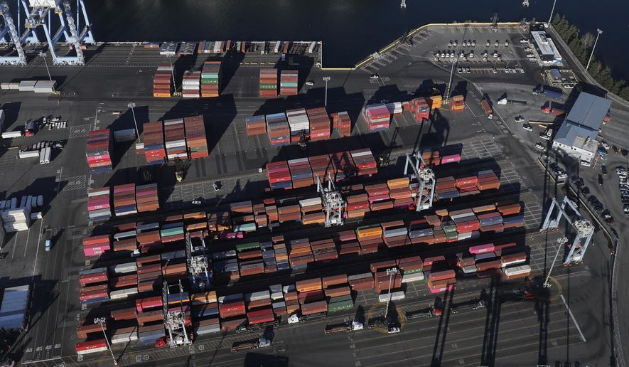 FILE - In this March 5, 2019, file photo, cargo containers are staged near cranes at the Port of Tacoma, in Tacoma, Wash. On Thursday, June 6, the Commerce Department reports on the U.S. trade gap for April. (AP Photo/Ted S. Warren, File)
