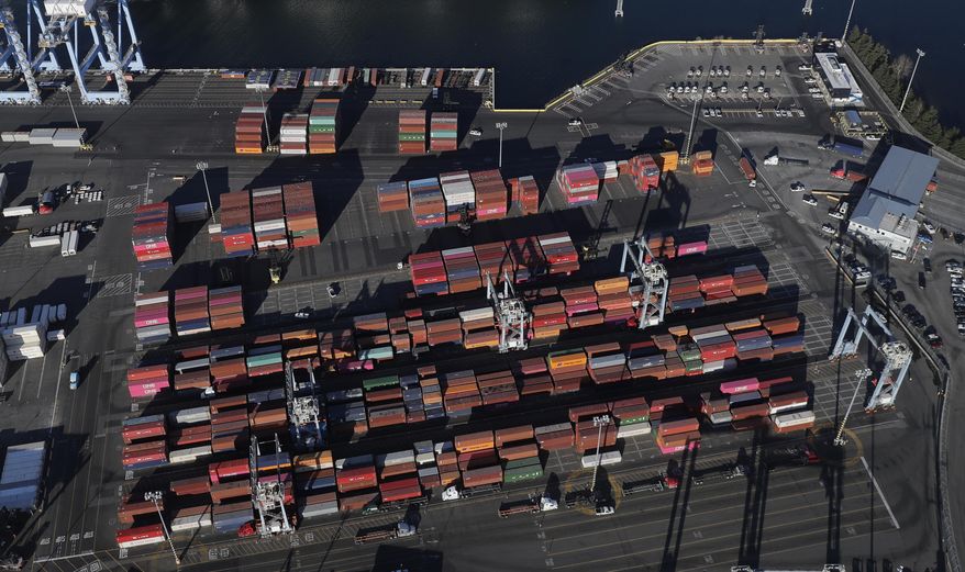 FILE - In this March 5, 2019, file photo, cargo containers are staged near cranes at the Port of Tacoma, in Tacoma, Wash. On Thursday, June 6, the Commerce Department reports on the U.S. trade gap for April. (AP Photo/Ted S. Warren, File)