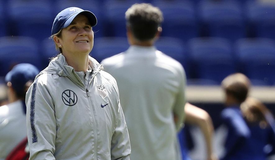 FILE - In this Saturday, May 25, 2019, file photo, United States women&#39;s national soccer team head coach Jill Ellis smiles during a training session at Red Bull Arena in Harrison, N.J. Ellis has criticized FIFA, soccer’s international governing body, for scheduling two other finals, for the CONCACAF Gold Cup and the Copa America, on the same day as the Women&#39;s World Cup championship game. (AP Photo/Steve Luciano, File)