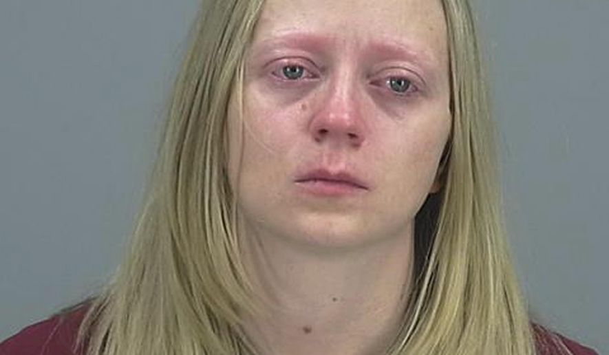 In this undated photo from the Pinal County Adult Detention Center is Kathryn Sinkevitch. A Tempe, Ariz., woman convicted of killing her ex-boyfriend amid a custody dispute has been sentenced to life in prison without possibility of parole. A Pinal County Superior Court judge sentenced 35-year-old Kathryn Sinkevitch on Thursday, June 6, 2019, on her first-degree murder conviction in the 2016 shooting of Michael Agerter. (Pinal County Adult Detention Center via AP)