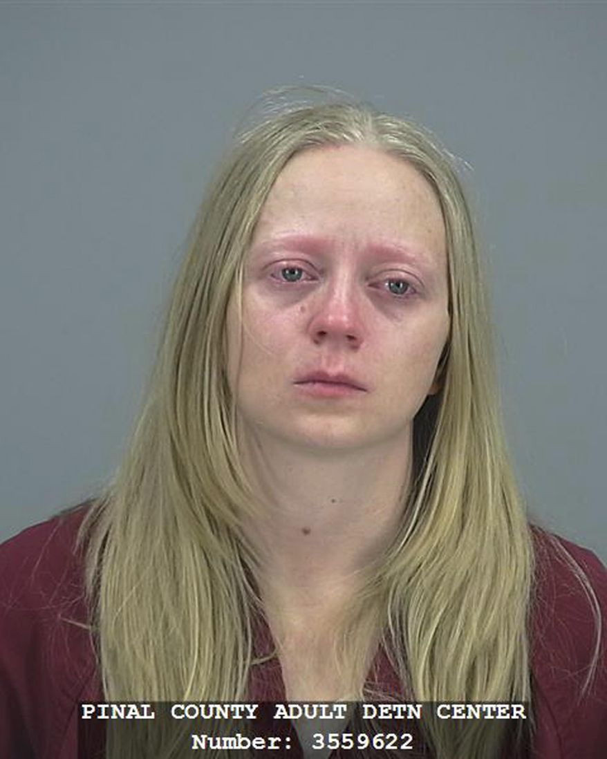 In this undated photo from the Pinal County Adult Detention Center is Kathryn Sinkevitch. A Tempe, Ariz., woman convicted of killing her ex-boyfriend amid a custody dispute has been sentenced to life in prison without possibility of parole. A Pinal County Superior Court judge sentenced 35-year-old Kathryn Sinkevitch on Thursday, June 6, 2019, on her first-degree murder conviction in the 2016 shooting of Michael Agerter. (Pinal County Adult Detention Center via AP)