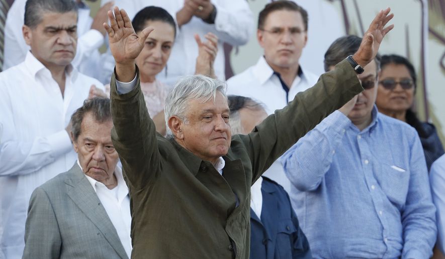 Mexican President Andres Manuel Lopez Obrador receives the applause of the crowd during a rally in Tijuana, Mexico, Saturday, June 8, 2019. Mexican President Andres Lopez Obrador held the rally in Tijuana even as President Trump has put on hold his plan to begin imposing tariffs on Mexico on Monday, saying the U.S. ally will take &quot;strong measures&quot; to reduce the flow of Central American migrants into the United States. (AP Photo/Eduardo Verdugo)